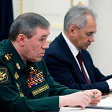 Two Russian officials attend meeting. 