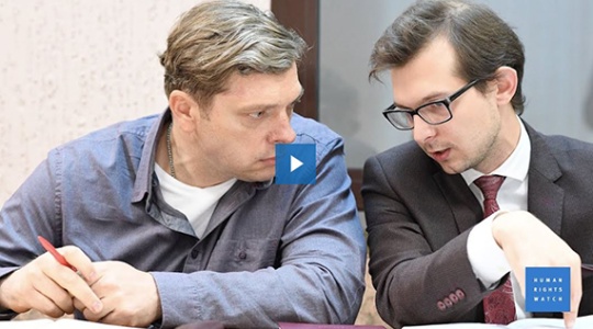 Two individuals in Belarus in conversation. 